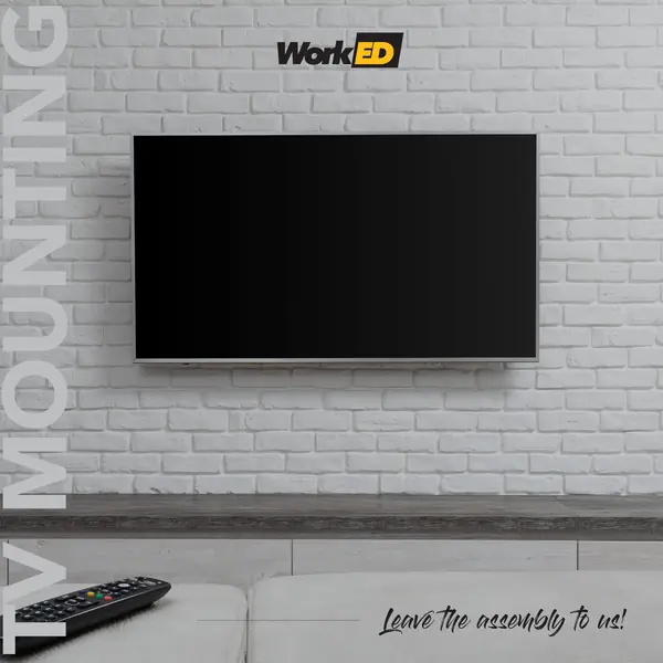 Flat-screen TV mounted on a white brick wall